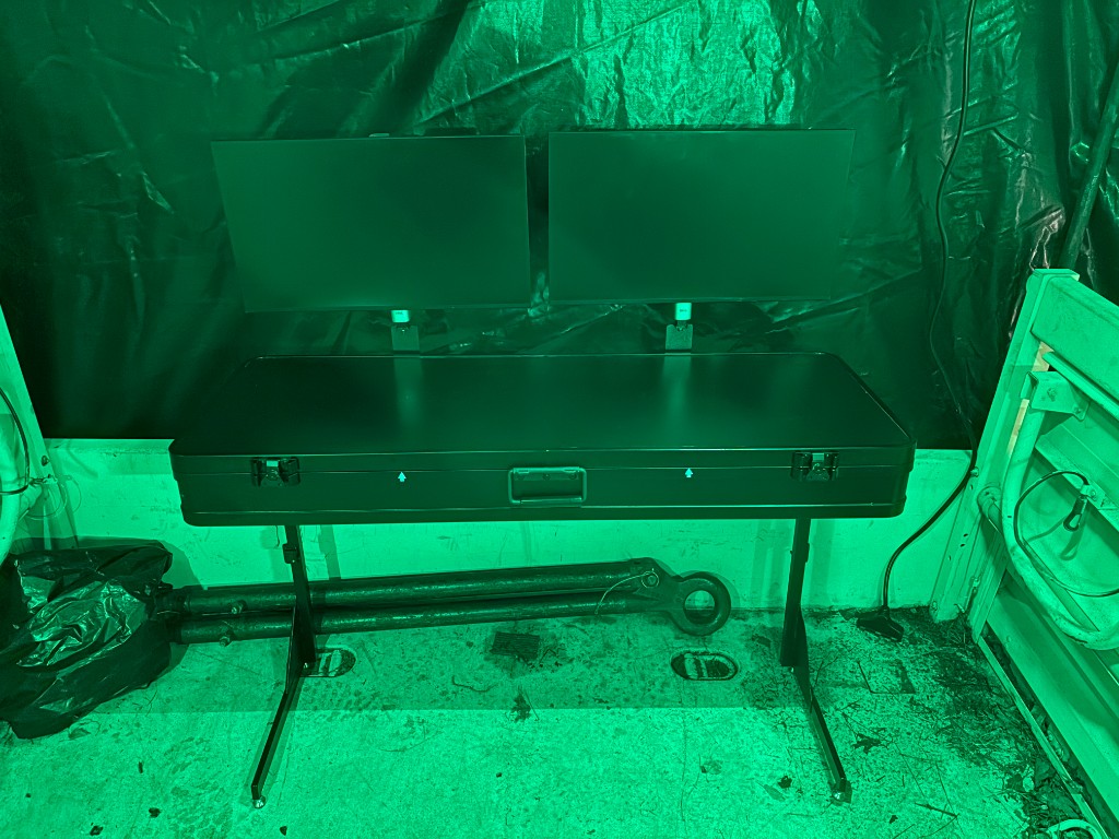 Skydyne TOC Table — AC/DC deployable workstation with dual monitors in a tactical field environment